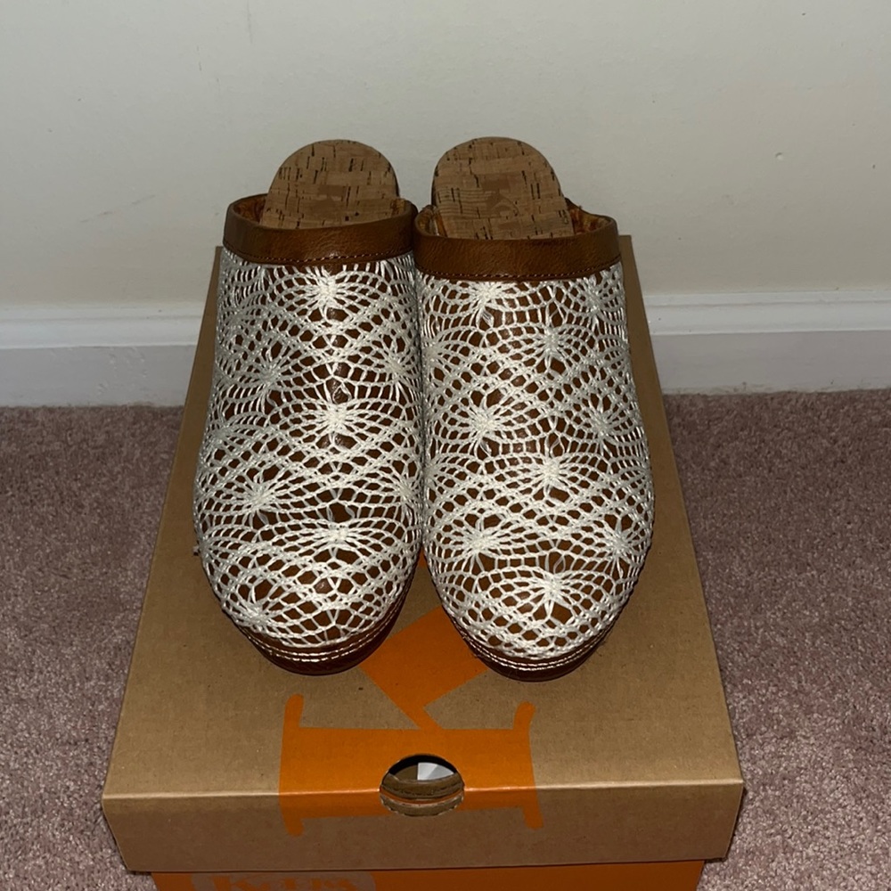heeled clogs with lace over top of foot